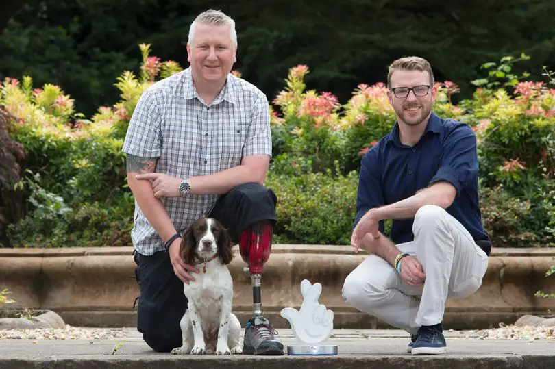 men and dog