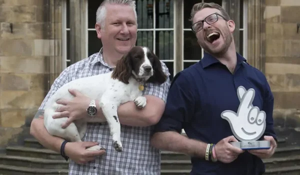 men and dog