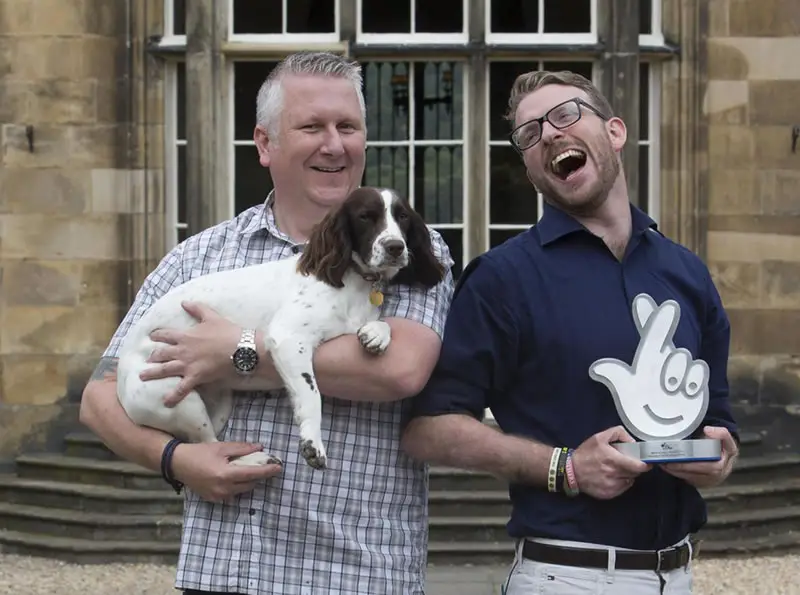 men and dog
